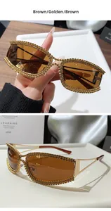 Close-up of golden metal sunglasses frame with rhinestone details and brown lenses