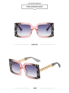 Detail of pink leopard square sunglasses with gold chain temples and gray gradient lenses