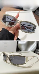 Close-up of vintage cat-eye sunglasses with silver metal frame and sparkling rhinestones
