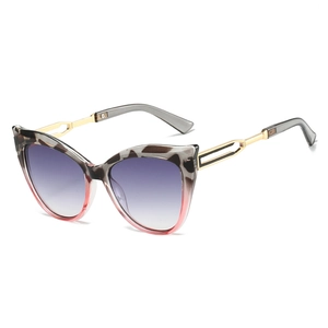 Cat-eye sunglasses with gradient lenses and decorative metal hollow-out temples