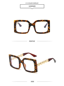 Detail of leopard print square frames and golden chain link temples on fashion sunglasses