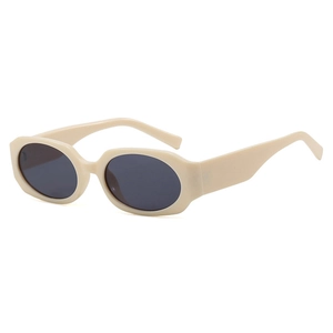 Lunettes de soleil rétro ovales en monture blanc cassé avec des verres gris foncé