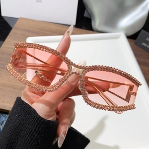 Chic pink cat-eye sunglasses with rhinestone edges and transparent lenses for women