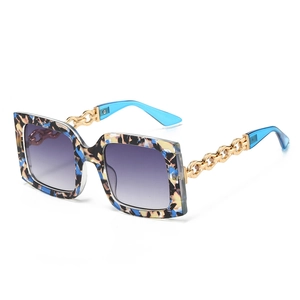 Fashion square oversized sunglasses with colorful pattern and gold chain temples
