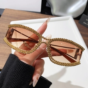 Retro cat-eye sunglasses with gold rhinestone frames and brown lenses for women