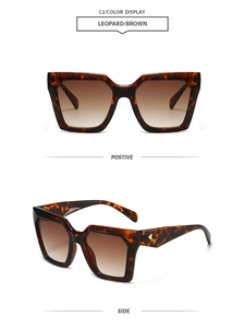 Detail of leopard print square sunglasses with gold metal accents and brown gradient lenses