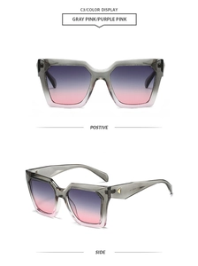 Detail view of square gray-pink gradient sunglasses with golden triangle trim