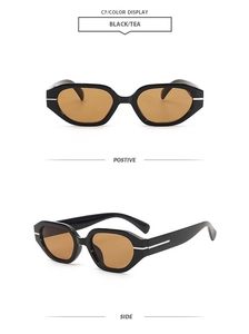 Detail of vintage irregular black sunglasses with tea lenses and silver temple accents