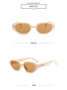 Detail of beige irregular sunglasses with tea lenses and silver metal hinges