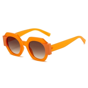 Fashionable bright orange geometric round frame sunglasses with brown gradient lenses