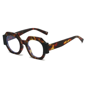 Modern geometric tortoiseshell sunglasses with black thick temples on white background