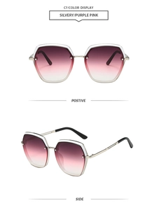 Detail view of large hexagonal sunglasses featuring purple-pink gradient lenses and silver frame