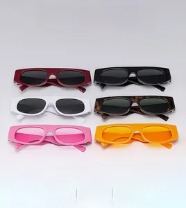 Flat lay of retro square sunglasses in multiple colors including black, white, and leopard