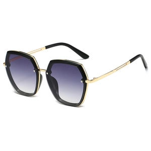 Fashionable oversized hexagonal sunglasses with gold metal frames and gradient lenses