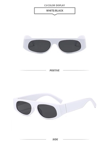 Detail view of white rectangular retro Y2K sunglasses with dark black lenses and side frame