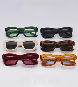 Flat lay of retro rectangle sunglasses in various colors including tortoiseshell and ivory