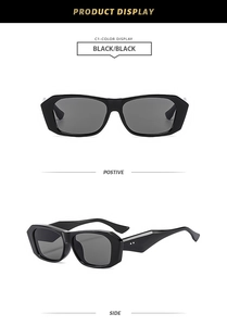 Detail view of black chunky square sunglasses featuring silver rivets and grey lenses
