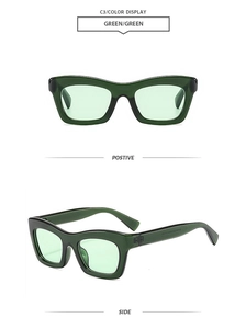 Detail view of vintage chunky cat-eye sunglasses with translucent green frames and lenses