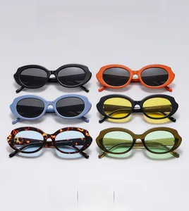 Flat lay of retro oval sunglasses featuring stylish wavy frames in six assorted colors