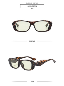 Detail of tortoise shell thick frame sunglasses with green lenses and rivet accents