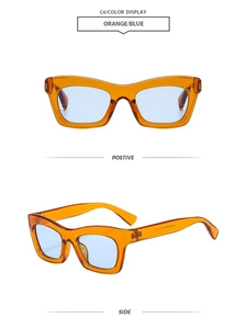 Front and side view of cat-eye sunglasses with amber frames and light blue lenses