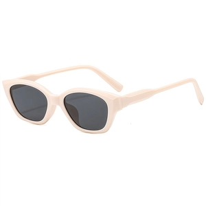 Classic cat eye sunglasses with cream beige frames and dark grey lenses in 45-degree view