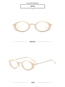 Detail view of beige oval glasses frame with gold metal temples and clear nose pads