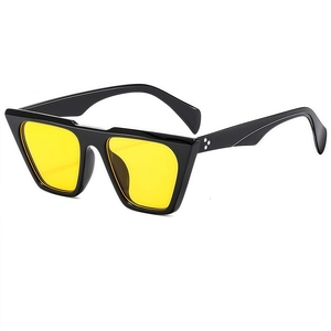 Fashionable oversized polygonal sunglasses with bright yellow lenses and black frames