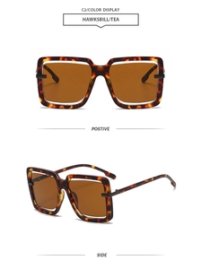 Detail view of tortoiseshell square frame sunglasses with tea-colored lenses and cutout design