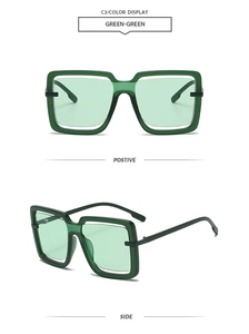Detail view of square green oversized sunglasses showing front and side metal hinges
