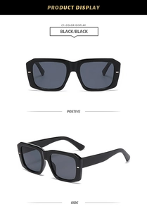 Close-up of retro square black frames and dark grey lenses with smooth texture details