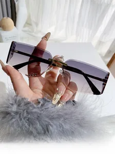 Detailed view of rimless square sunglasses with purple-grey gradient lenses and gold frame