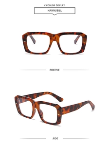 Detail of square tortoiseshell sunglasses showing hawksbill pattern and thick frame construction