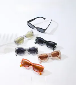Flat lay of retro oval sunglasses in six colors with thick frames and metal studs
