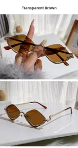 Detail of rimless rhombus sunglasses with brown lenses and sparkling diamond accents