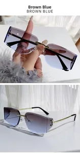 Detail of rimless square sunglasses with brown-blue gradient lenses and gold temples