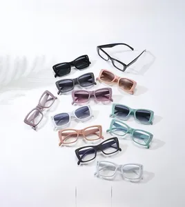 Flat lay of colorful square frame sunglasses featuring metallic dot rivets on wide temples