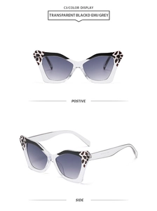 Cat eye sunglasses featuring transparent frames with leopard print detail and grey lenses