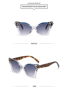 Detail of butterfly frame sunglasses with blue demi panels and grey gradient lenses