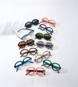 Collection of retro oversized sunglasses in vibrant colors like orange and tortoiseshell