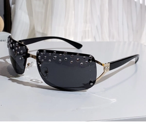 Detail of rimless sunglasses with gradient grey lenses and rhinestone embellishments