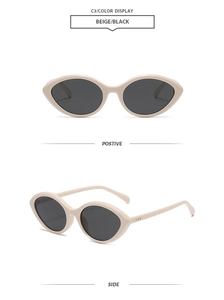Detail view of beige oval cat-eye sunglasses with dark lenses and metal accents