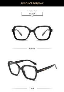 Detail of black glasses frame showing golden stripe metal hinges and sleek temples