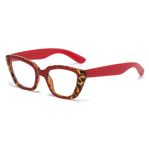 Lunettes de soleil œil-de-chat irrégulières avec monture écaille et branches rouges