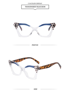 Detail view of transparent blue demi butterfly sunglasses with tortoise temple accents