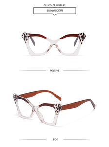 Detail of butterfly cat eye sunglasses in transparent brown with leopard print accents