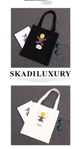 Detail view of black and cream canvas tote bags with girl jumping rope cartoon print