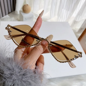 Chic rimless diamond-studded sunglasses with brown lenses and golden metal temples