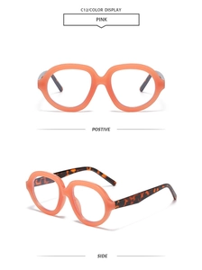 Detail of pink transparent round frame sunglasses with stylish tortoiseshell patterned temples