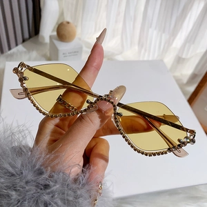 Fashionable rimless rhombus sunglasses with yellow lenses and sparkling rhinestone edges